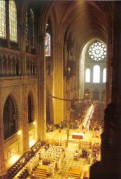 Illumination in Chartres Cathedral, celebrants under West rose window (194) facing east towards choir